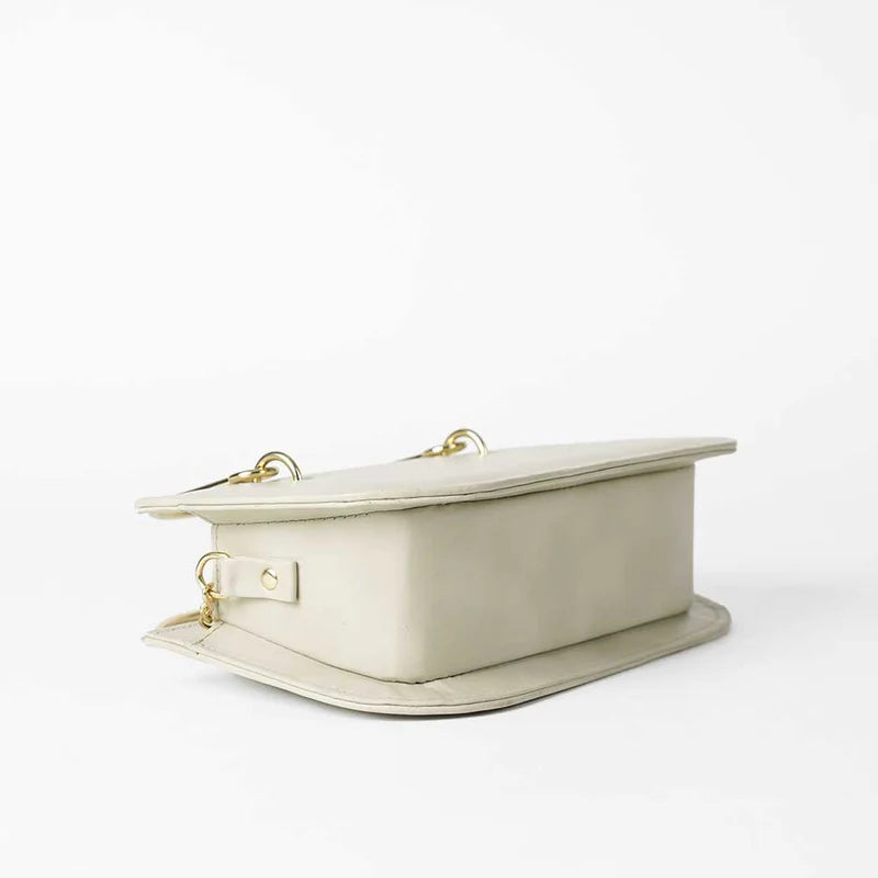 Beige Handbag with Gold Chain Strap and Metal Top Handles